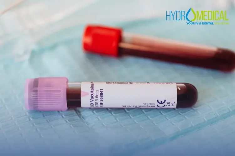 Medical professional taking a blood sample from a patient's arm for an at-home lab test in Bali.