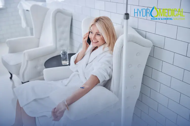 Patient relaxing while receiving a Hydro Medical IV vitamin therapy drip at their home in Canggu, Bali.