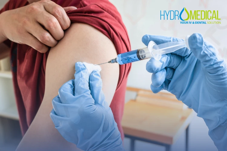 Doctor preparing a travel vaccination for a tourist patient at Hydro Medical Clinic Bali.