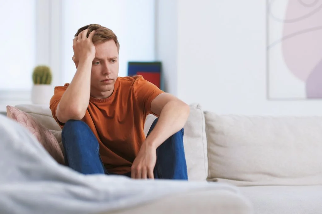 A person in Bali feeling anxious and worried over the STD symptoms
