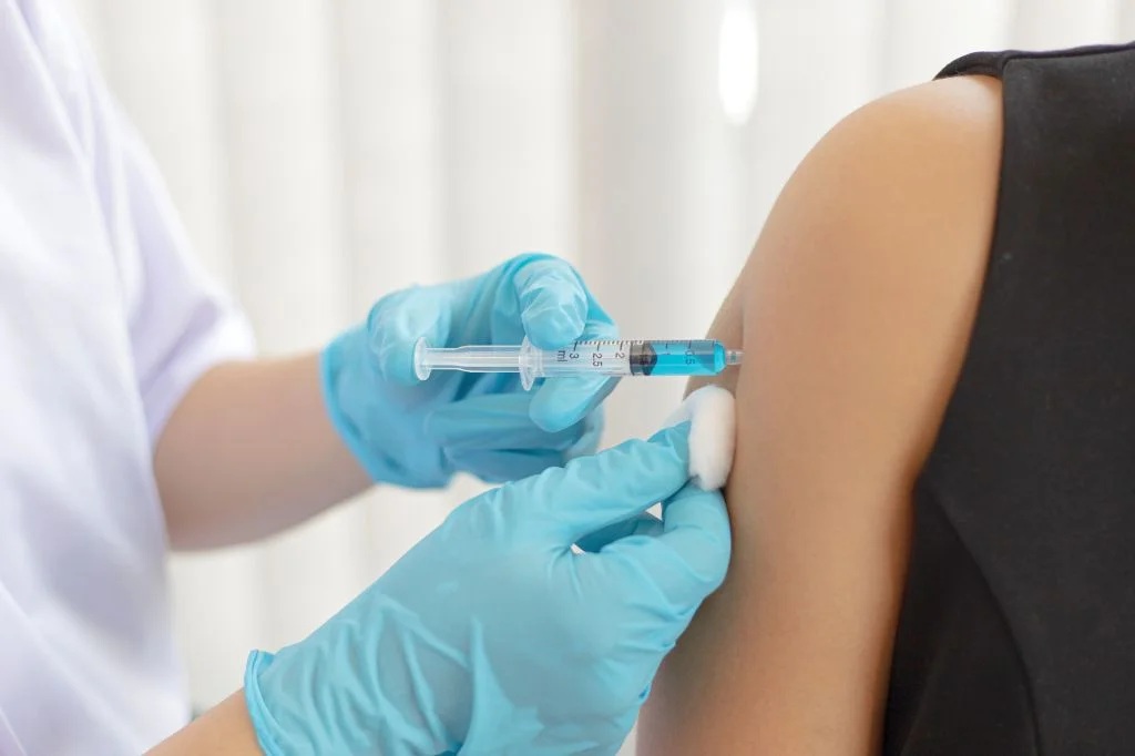 A doctor preparing a Gardasil-9 HPV vaccination.