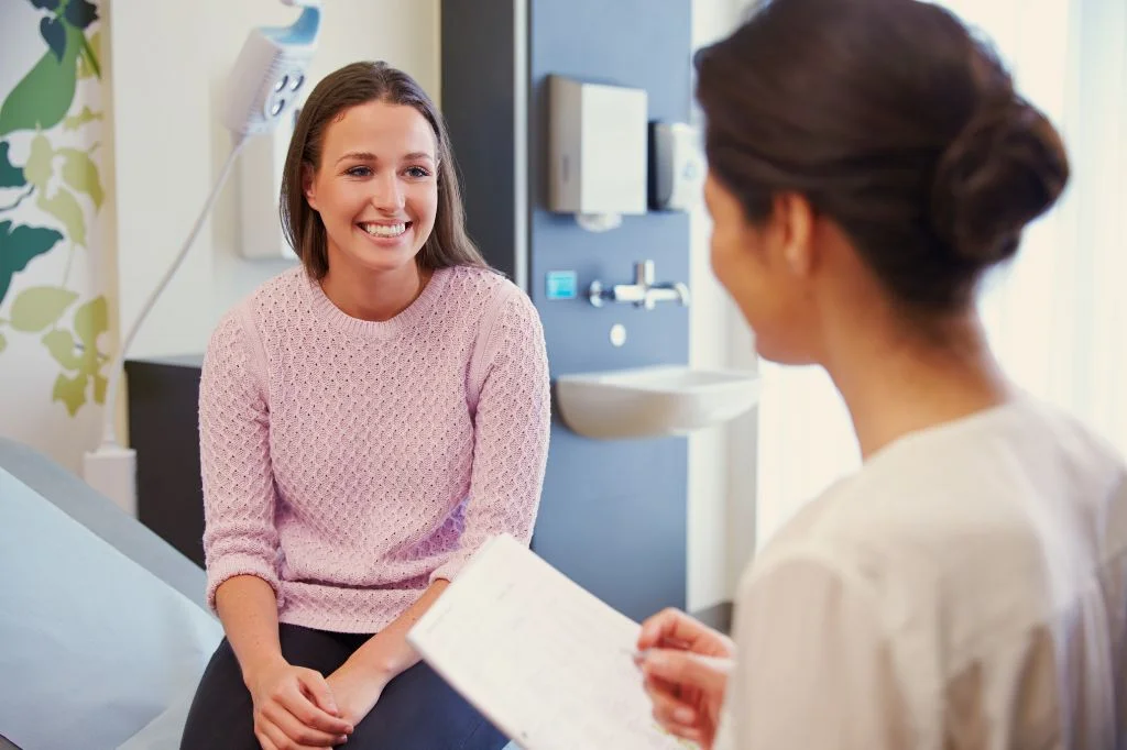 A doctor at Hydro Medical Clinic in Bali providing a professional diagnosis for a patient's symptoms.