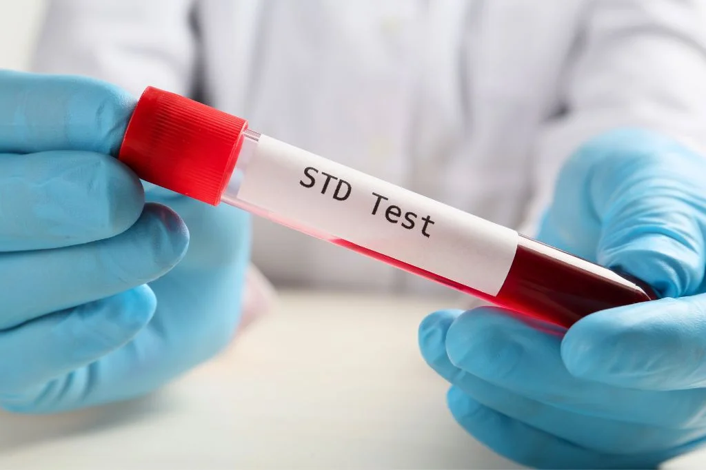 A lab technician at a clinic processing a sample for Gonorrhea testing and antibiotic resistance.