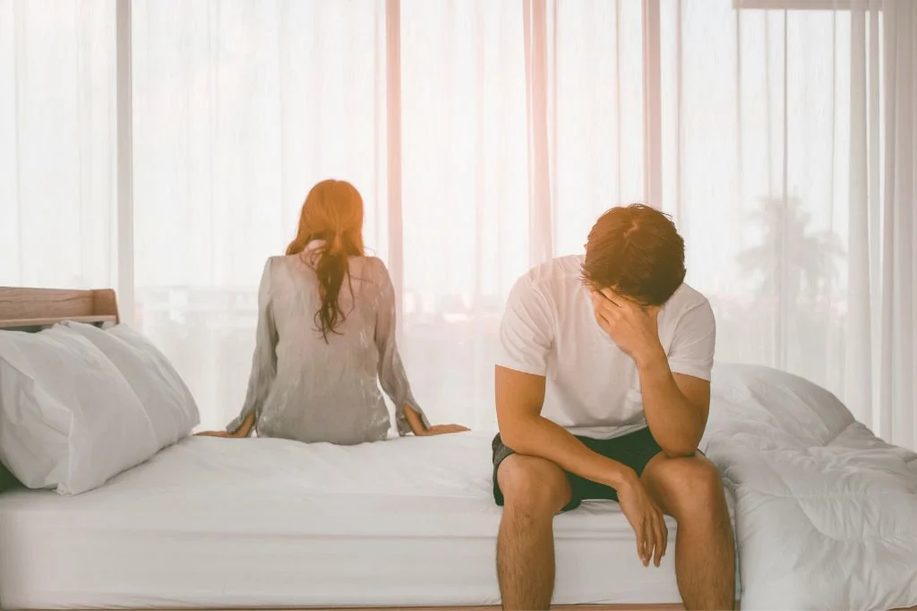 A couple in Bali looking thoughtful and concerned about the personal health risks of oral sex.