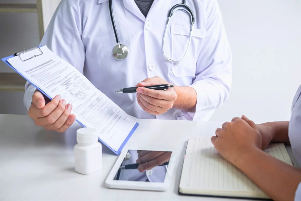 Doctor explaining immune response and side effects to a patient.