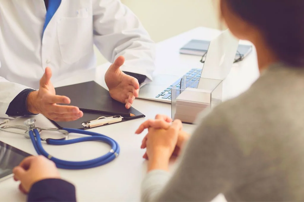 Doctor consulting with a patient about dog bite treatment and vaccination protocols.