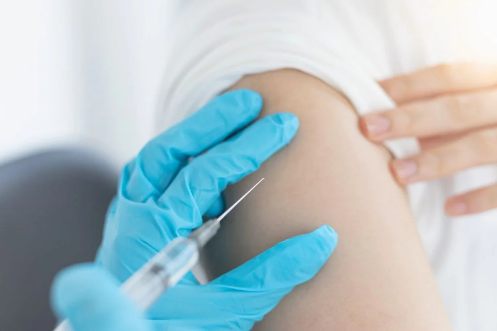 Doctor at Hydro Medical Clinic Bali preparing rabies vaccine (PEP) for a patient consultation