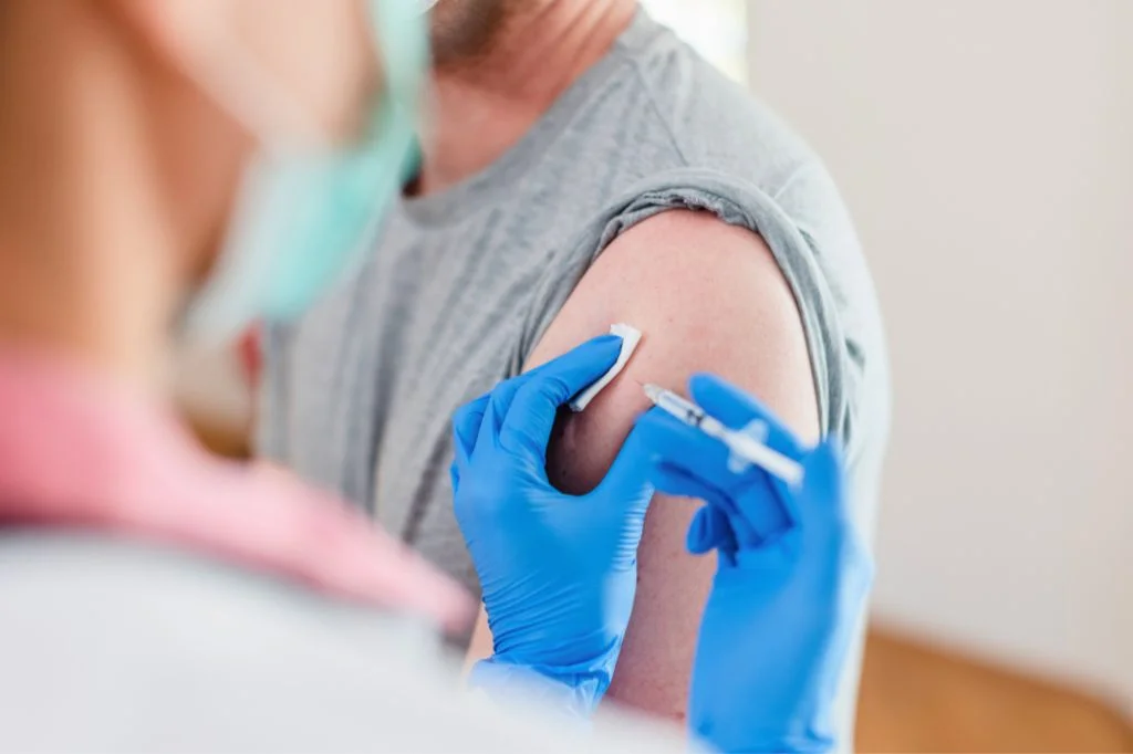 Doctor preparing rabies vaccine for immediate administration.