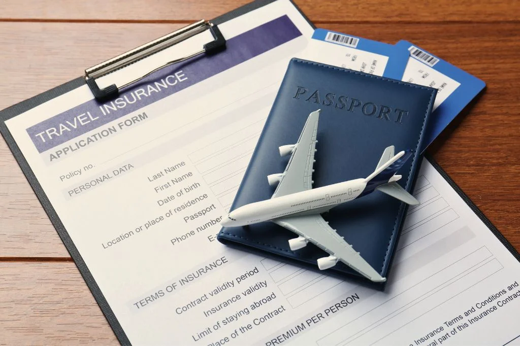 Patient holding travel insurance documents and passport for medical reimbursement in Bali.