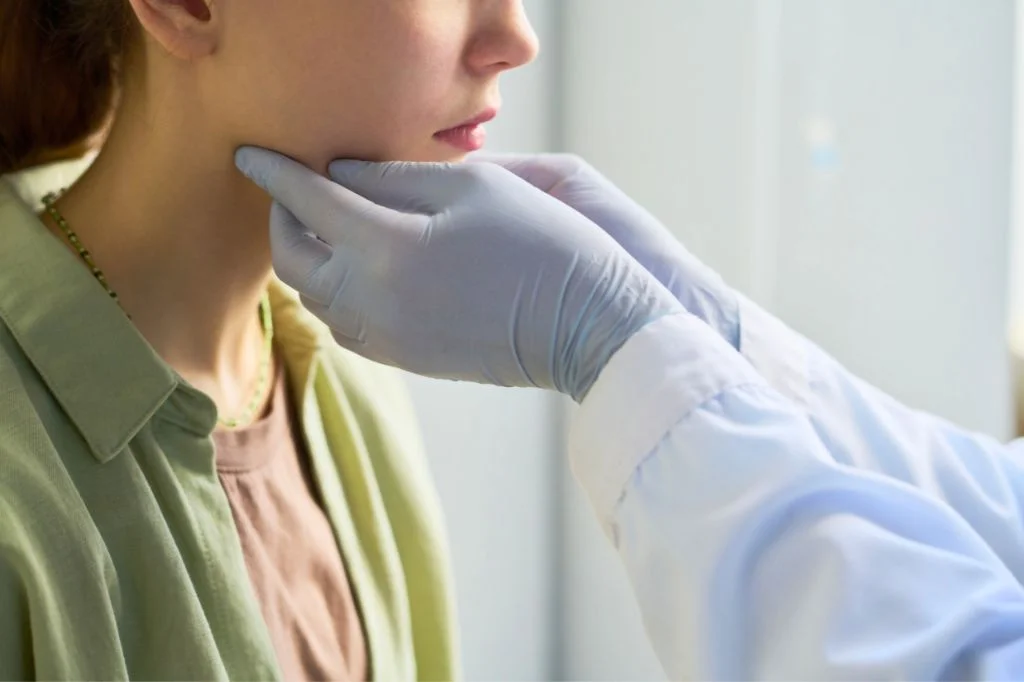 Hydro Medical ENT specialist performing a neck examination to rule out physical lumps or thyroid issues.
