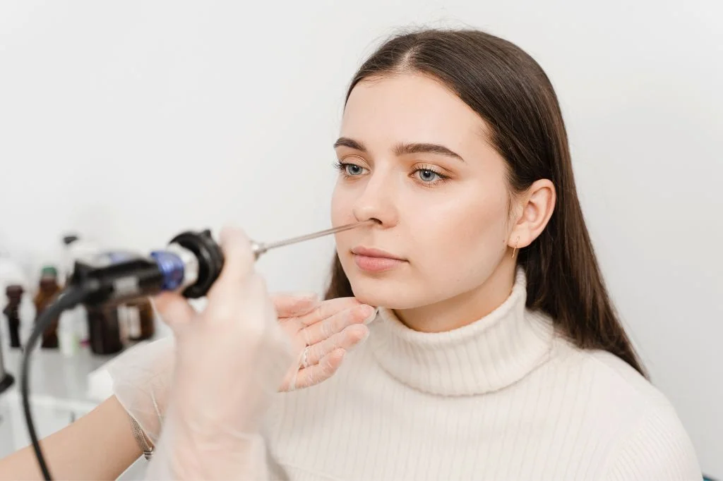Hydro Medical ENT specialist examining the nasal passage to diagnose the cause of smell loss.