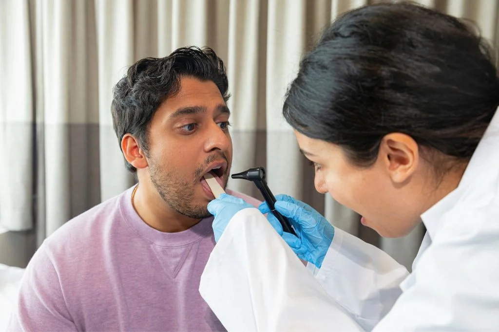 Hydro Medical ENT specialist examining a patient's throat for signs of airway obstruction.
