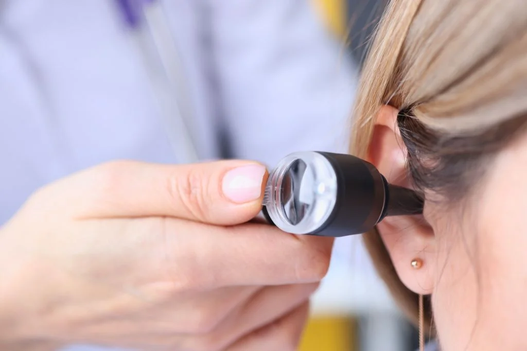 Hydro Medical ENT specialist performing microsuction to remove fungal debris from the ear canal.