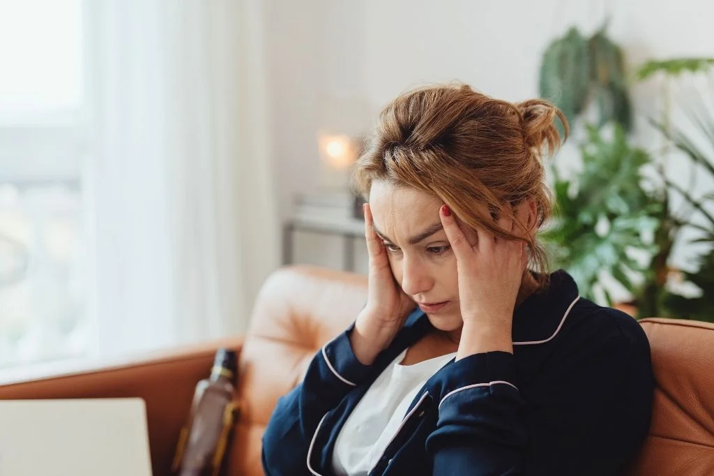 A traveler feeling nauseous and dizzy, questioning can an ear infection cause vomiting.