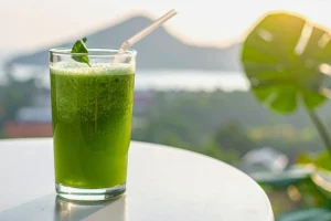 A trendy detox juice in a Bali setting, representing the popular island cleanse culture.