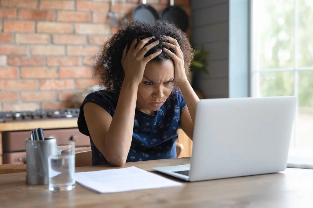 A professional person experiencing brain fog while working in Bali.