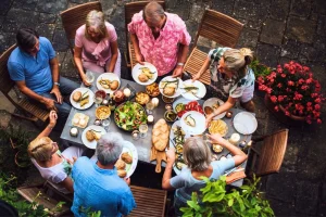 An expat enjoying Bali's dining scene while unaware of potential high cholesterol risks.