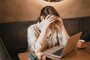 A person in Bali feeling frustrated by recurring symptoms and ineffective self-medication.