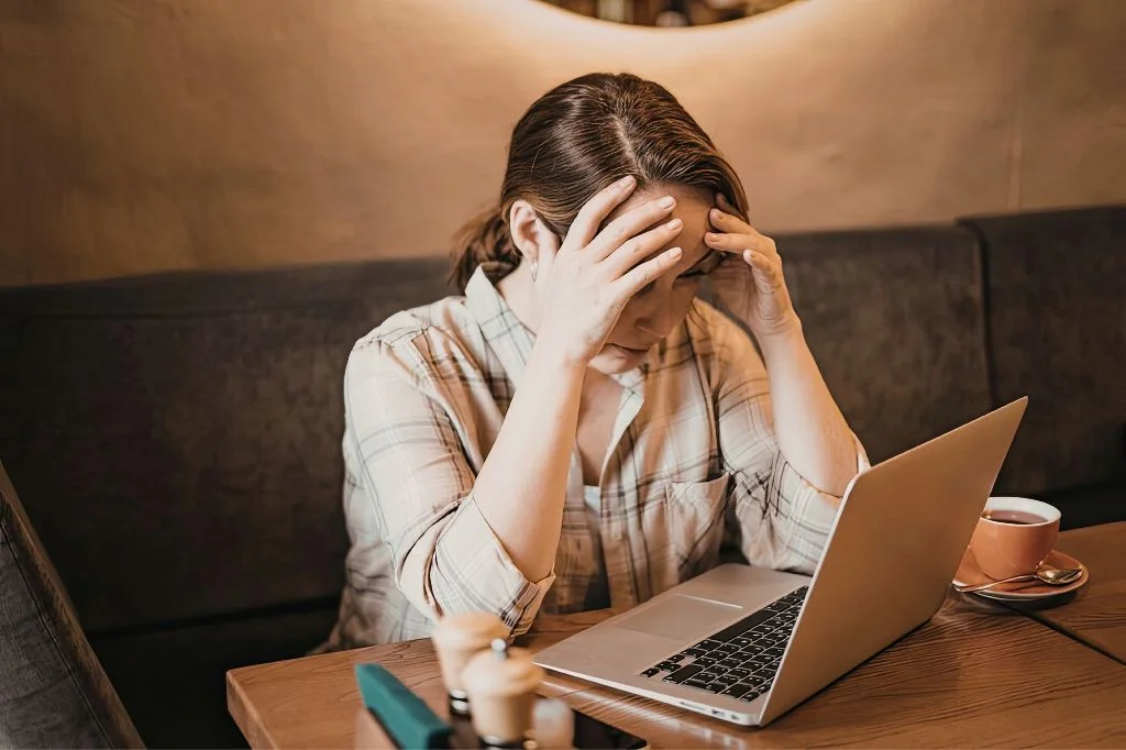 A person in Bali feeling frustrated by recurring symptoms and ineffective self-medication.