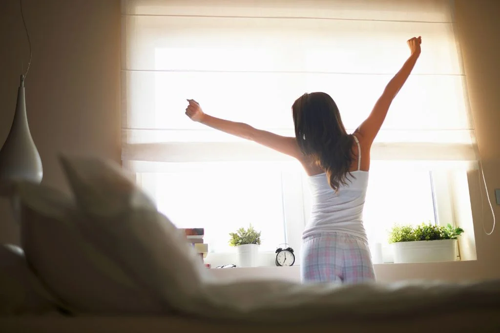 A person enjoying natural morning light, representing a balanced biological clock.