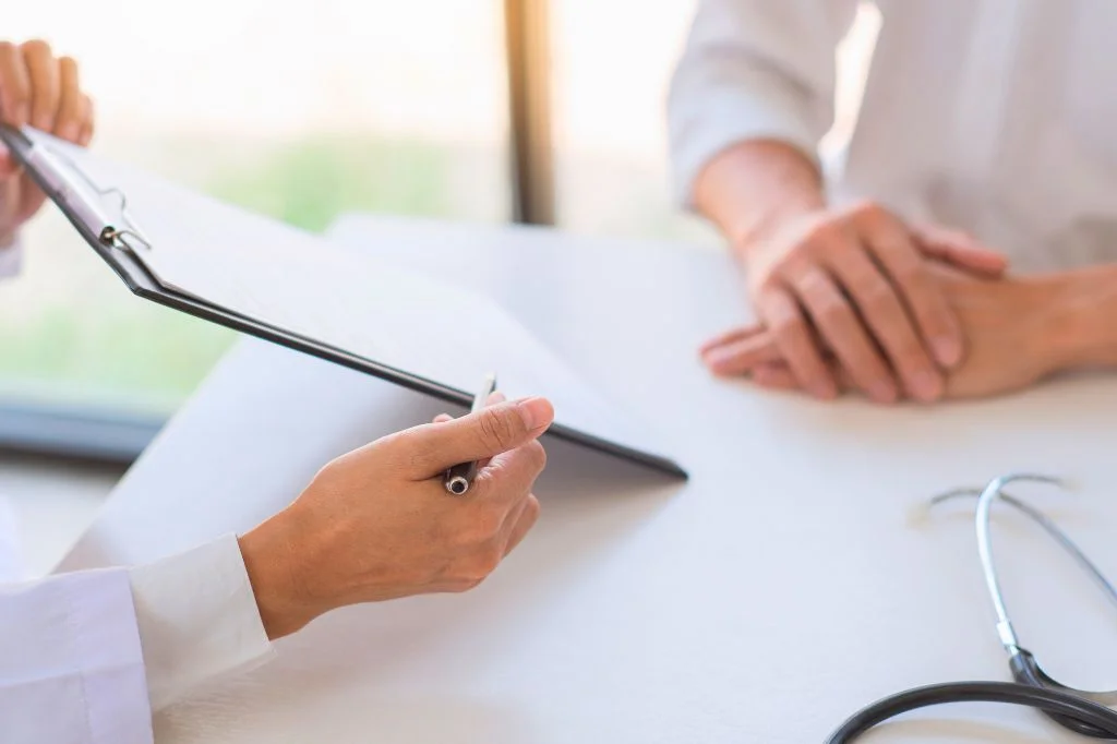 An internist at Hydro Medical Clinic explaining diagnostic results to a patient for clear health insights.