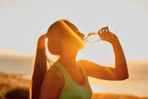 An expat staying hydrated while enjoying the tropical Bali environment.