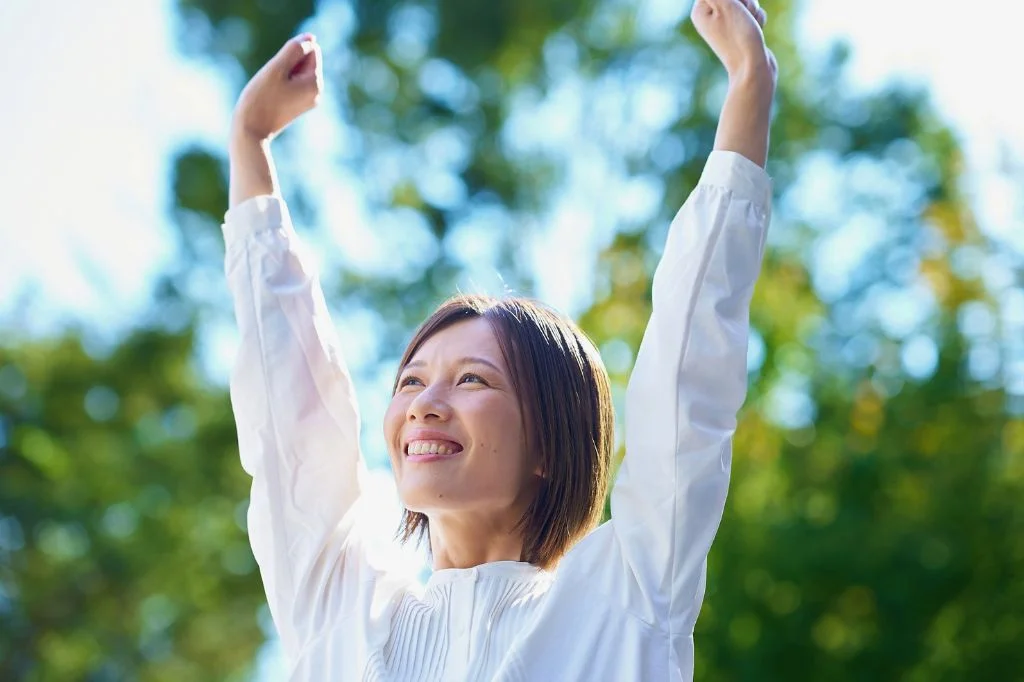 A person feeling relaxed and happy after having a professional consultation with an internal medicine specialist in a modern clinic.