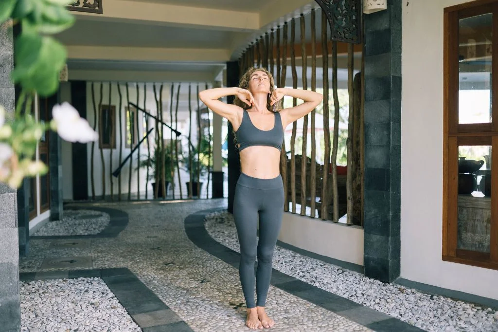 Enjoying perfect posture and a naturally flat stomach in Bali after correcting an anterior pelvic tilt and strengthening the core.