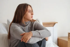 An individual in Bali reflecting on persistent internal symptoms that may be progressing silently.
