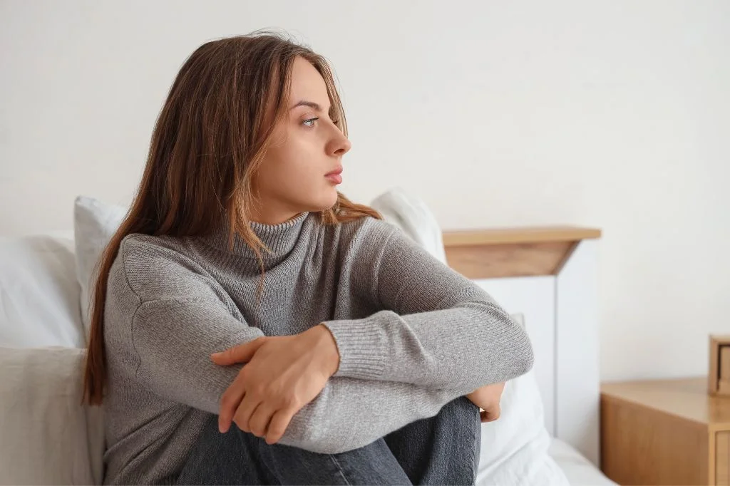 An individual in Bali reflecting on persistent internal symptoms that may be progressing silently.
