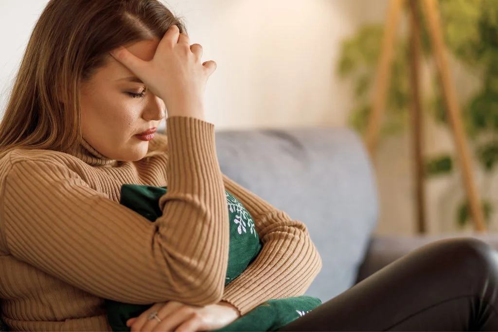 An expat in Bali experiencing quiet worry and physical discomfort due to an unmanaged chronic condition, highlighting the mental burden of instability.
