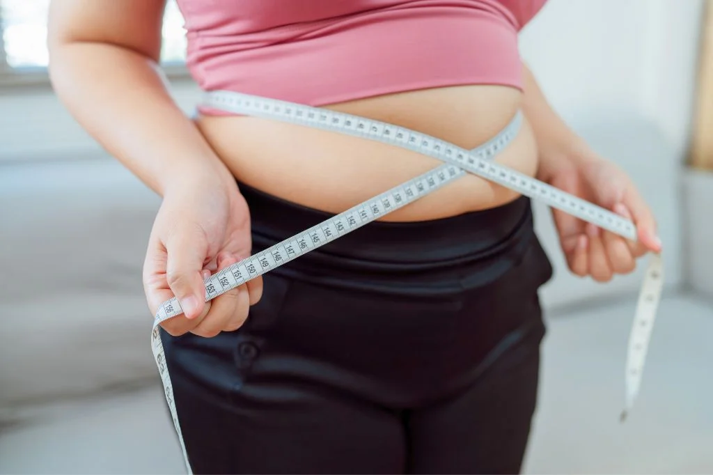 An expat in Bali struggling with a weight gain plateau despite healthy habits.