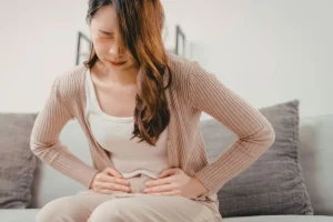 A traveler experiencing Bali Belly symptoms in their accommodation.