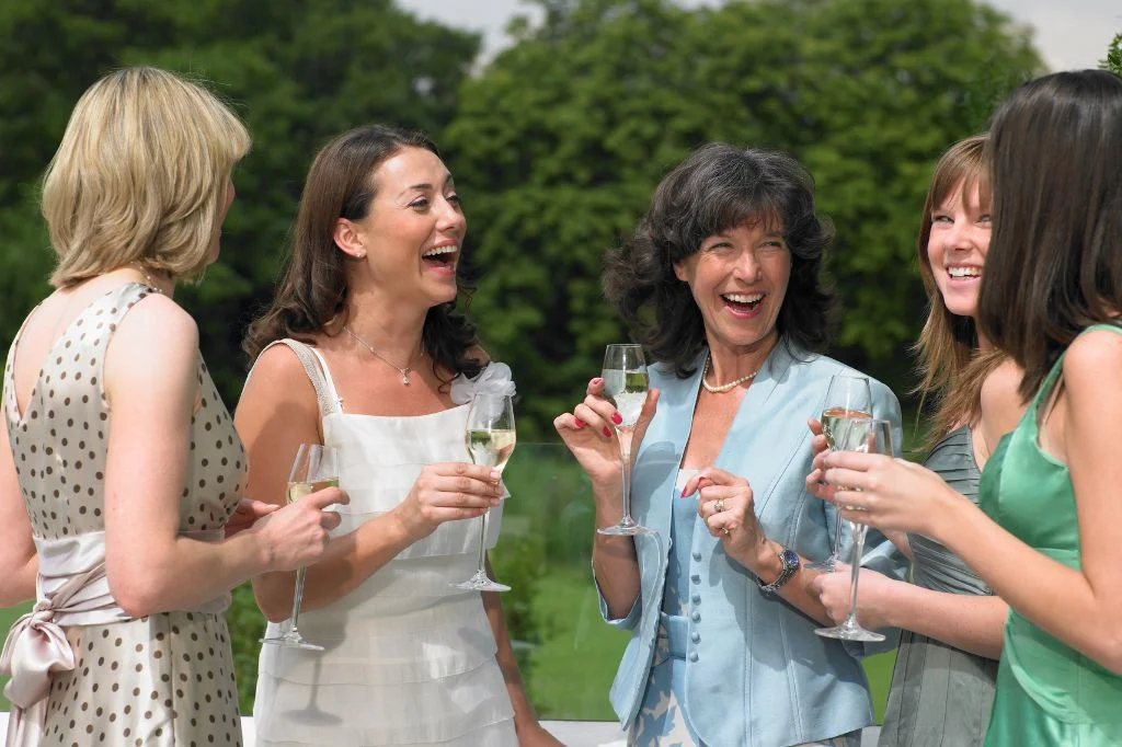 A group of joyful guests enjoying a healthy and energized outdoor wedding in Bali.