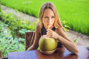 A refreshed traveler maximizing their recovery after an IV therapy session in Bali.