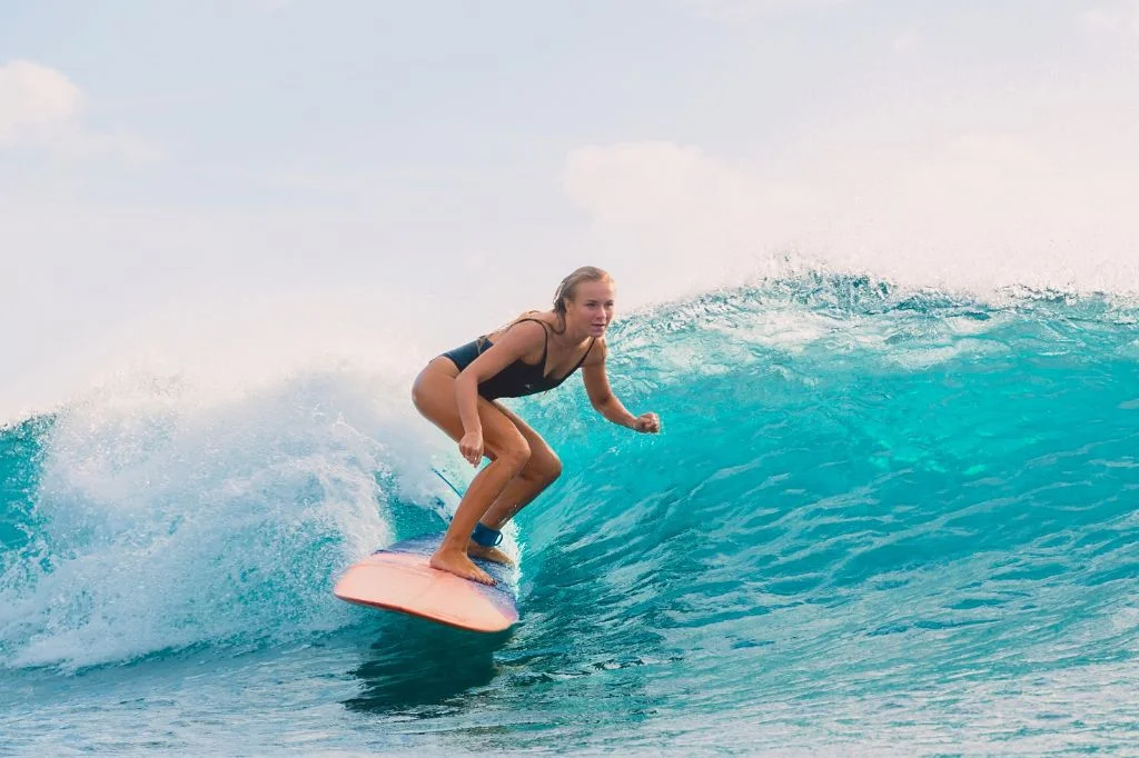 A vibrant woman enjoying outdoor activities in Bali after receiving IV drip treatment for period pain relief.