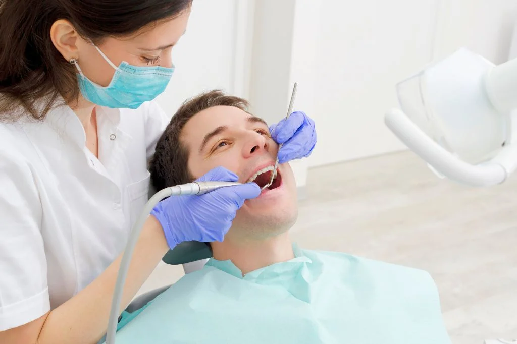 Professional teeth cleaning to remove nicotine and tobacco stains.
