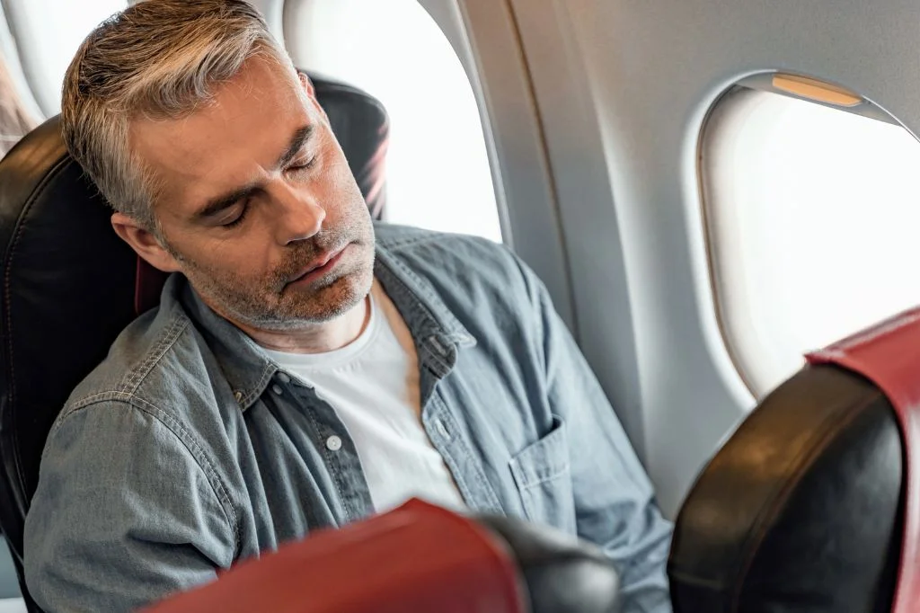 Recognizing travel fatigue symptoms after a long-haul flight to Bali.