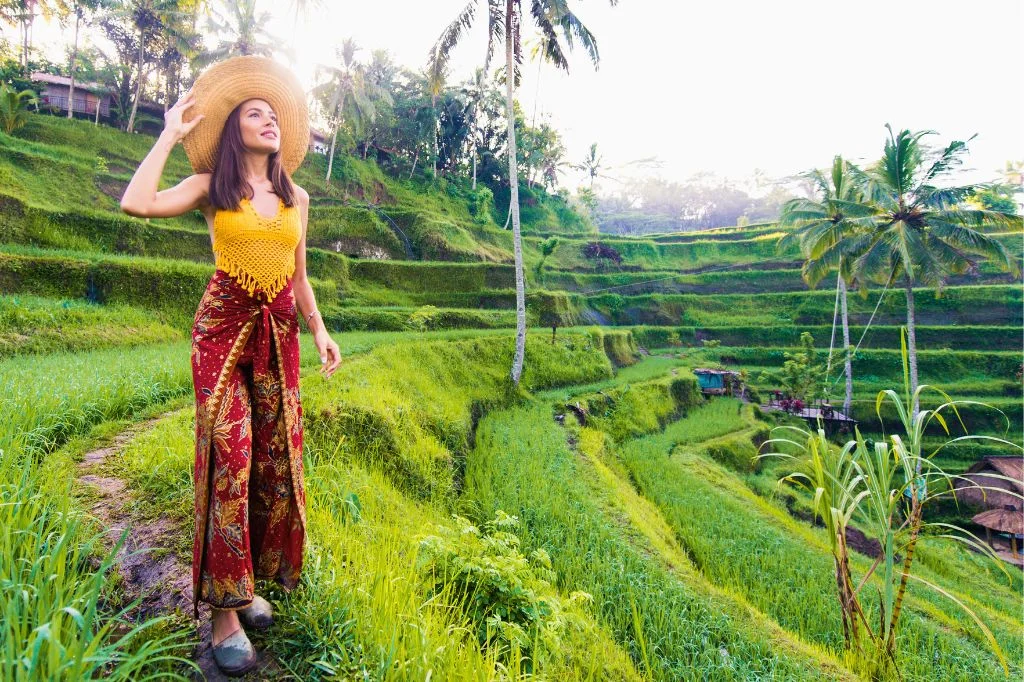 Female traveler enjoying the beautiful rice terraces or sunset after recovery.