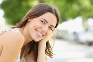 Confident, youthful smile with restored tooth length.