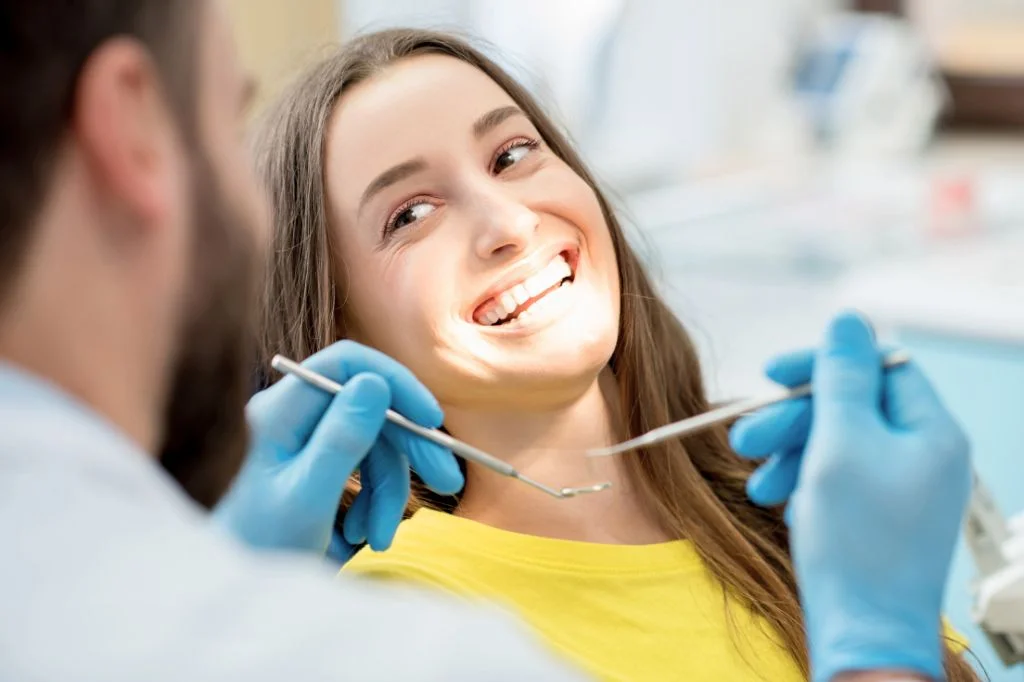 Dental examination for metallic taste causes at Hydro Medical.
