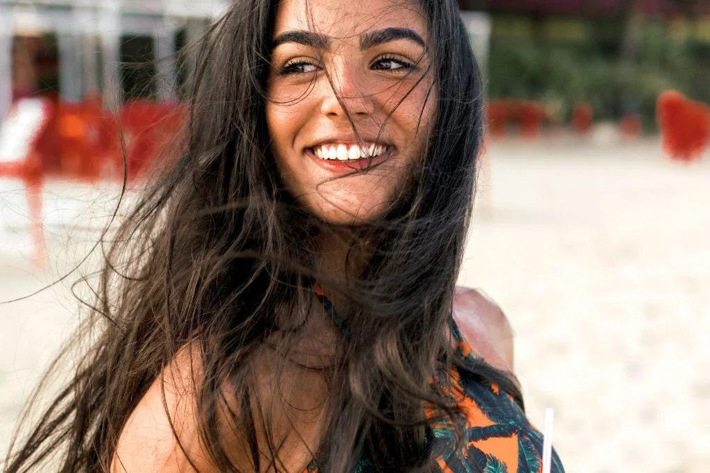 Person enjoying a good holiday in Bali with a healthy, natural smile.