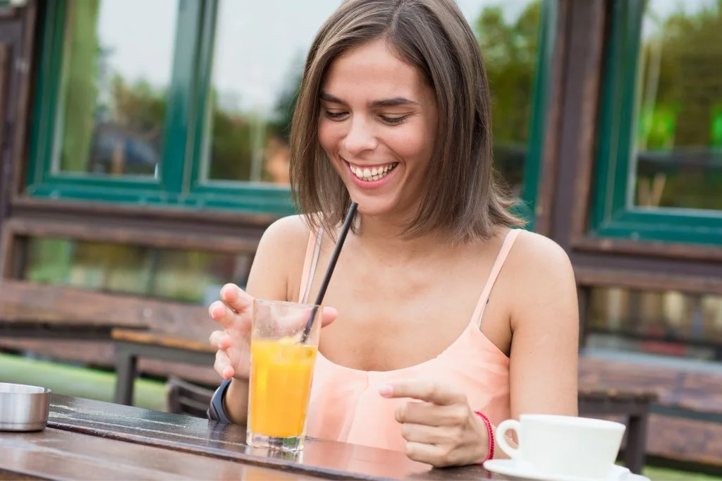 Enjoying cold drinks comfortably after replacing a faulty tooth filling.