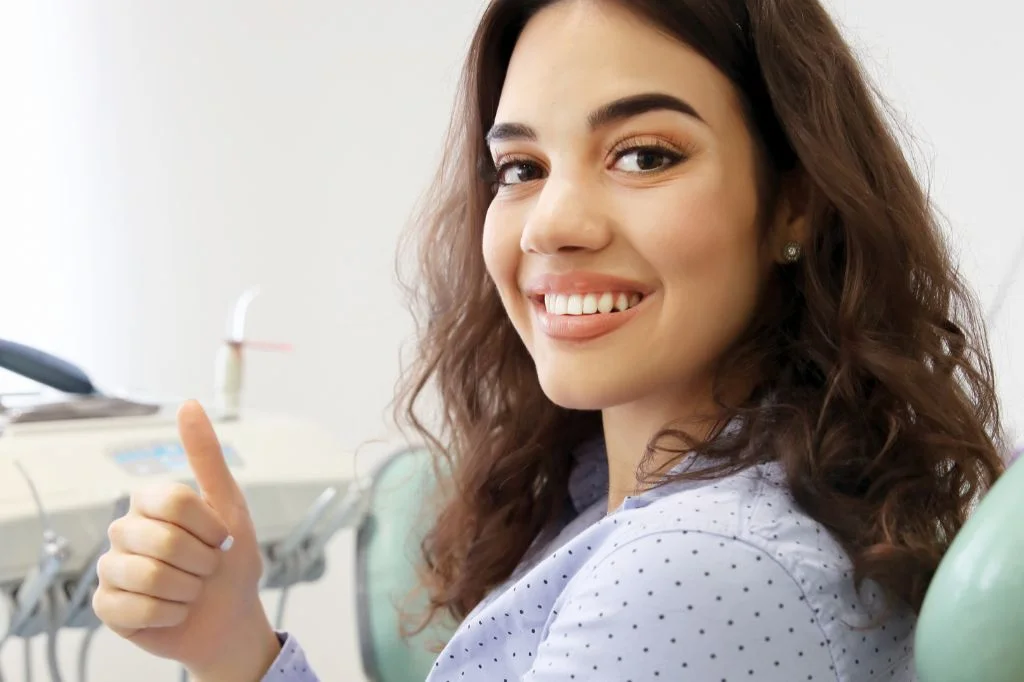 Patient enjoying a stress-free holiday in Bali with a protected, healthy smile post-bruxism therapy.