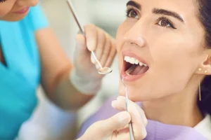 Professional dental inspection for loose filling repair at Hydro Medical Bali.