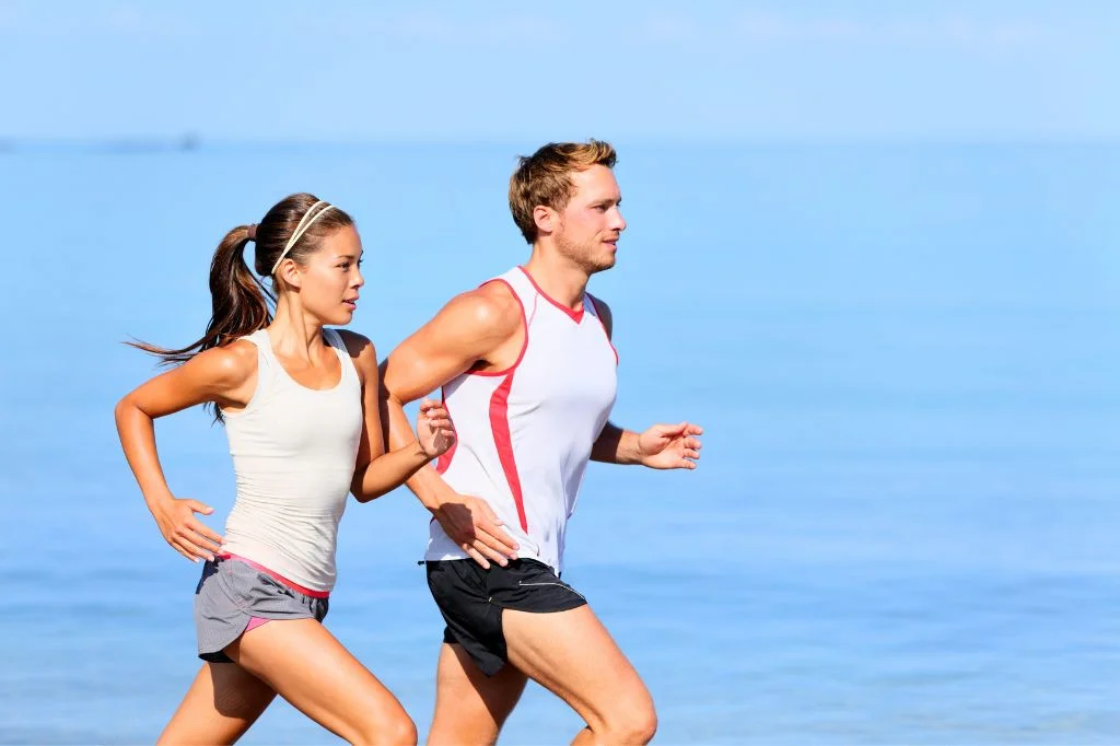 A fully recovered runner enjoying beach exercises in Bali without experiencing any shin splints symptoms.