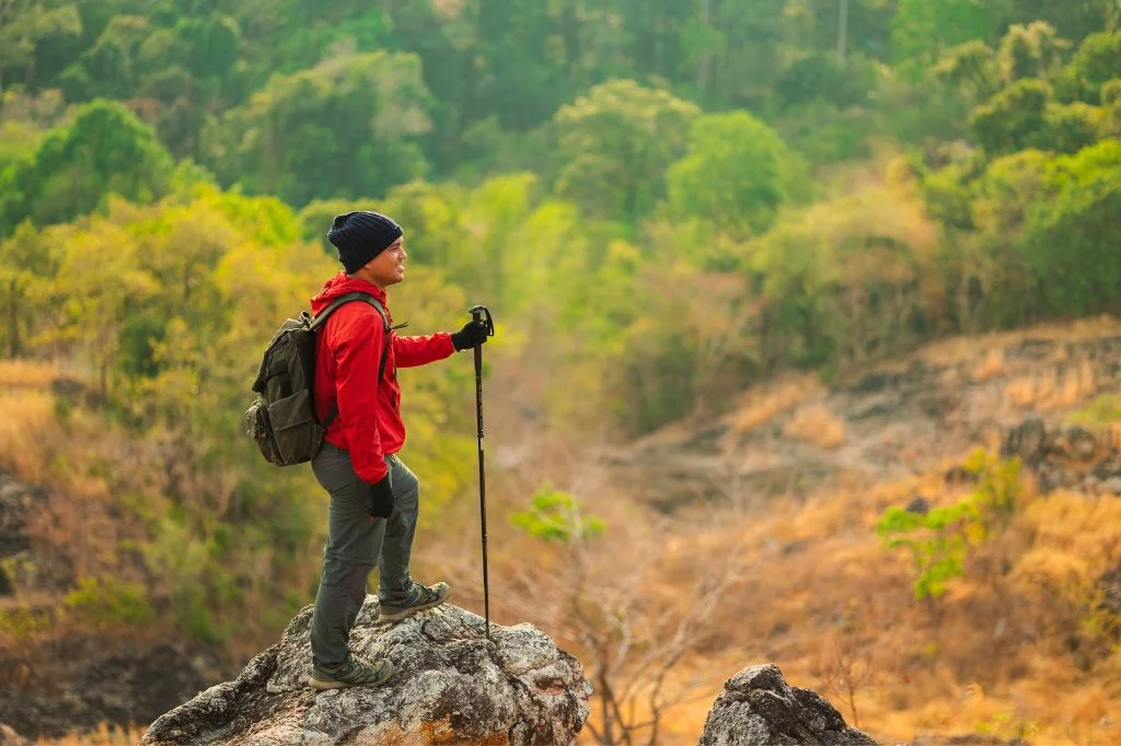 A tourist holding their helping stick on their Bali trekking