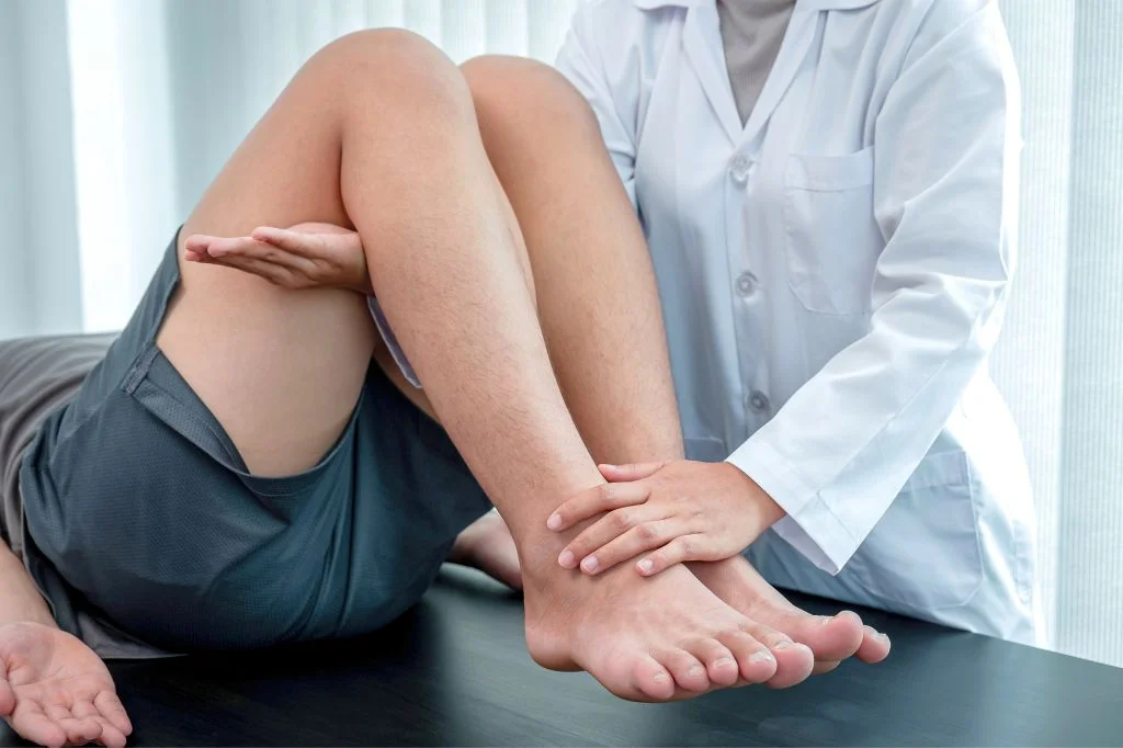 A professional physiotherapist treating a patient with muscle fatigue in Bali.