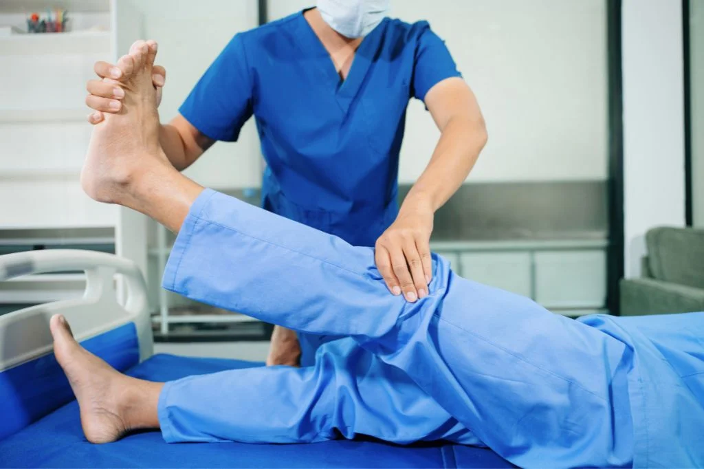A professional sports physiotherapy and joint mobilization session at Hydro Medical Clinic in Bali.