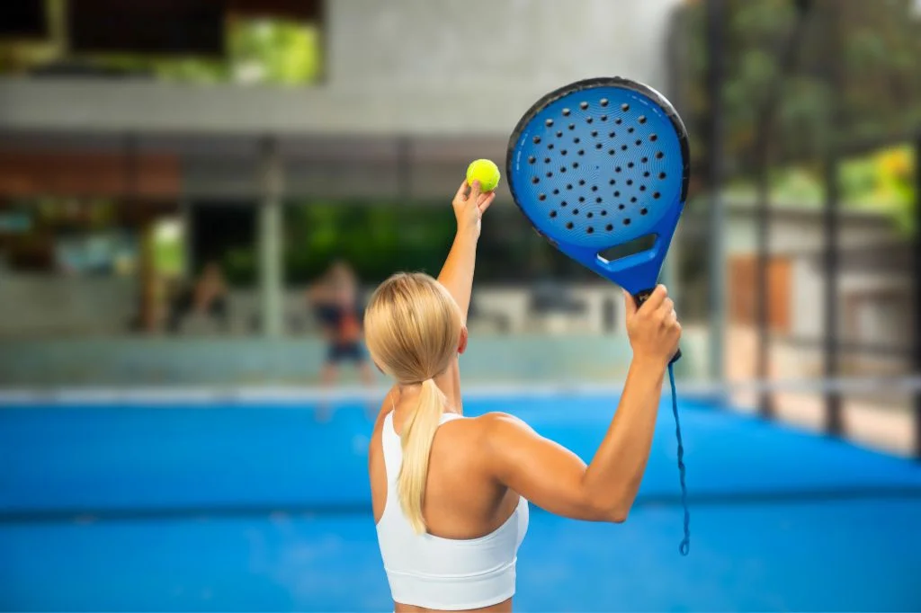 Expats enjoying a sunny game of Padel on an outdoor court in Bali.